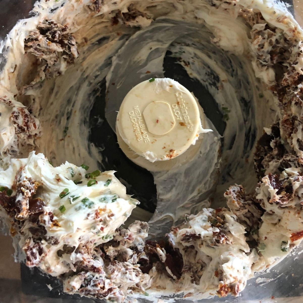 Sundried tomato schmear ingredients in a food processor