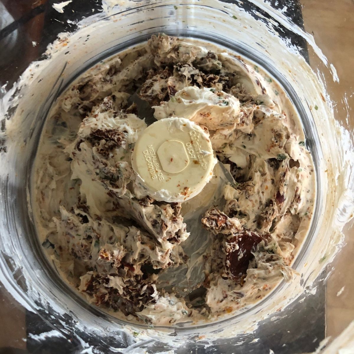 Sundried tomato schmear ingredients in a food processor