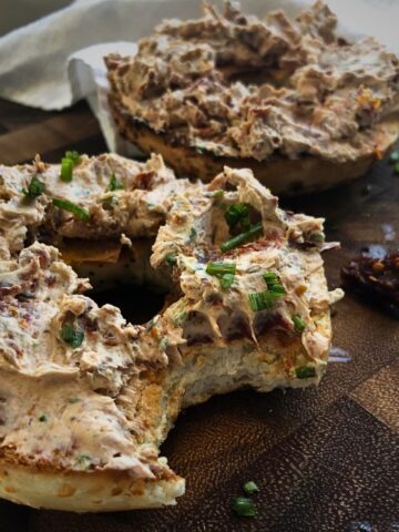 Sundried tomato schmear on a toasted everything bagel.
