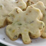 Pistachio shortbread cookie cut in a shamrock shape.