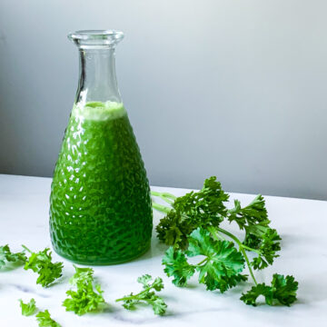 parsley simple syrup on a marble board
