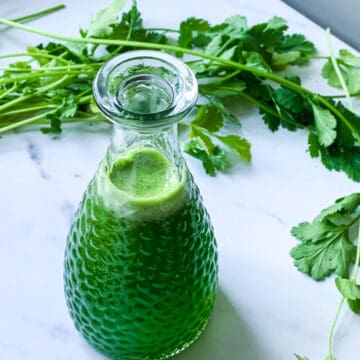 cilantro simple syrup on a marble board