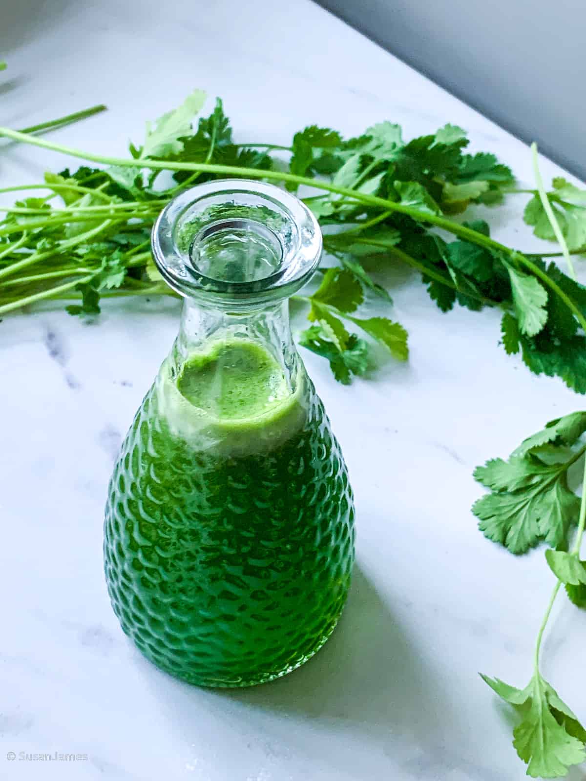 cilantro simple syrup on a marble board