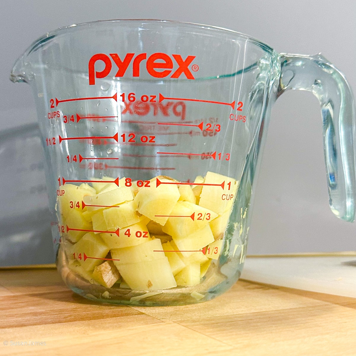 1 cup diced ginger in a measuring cup