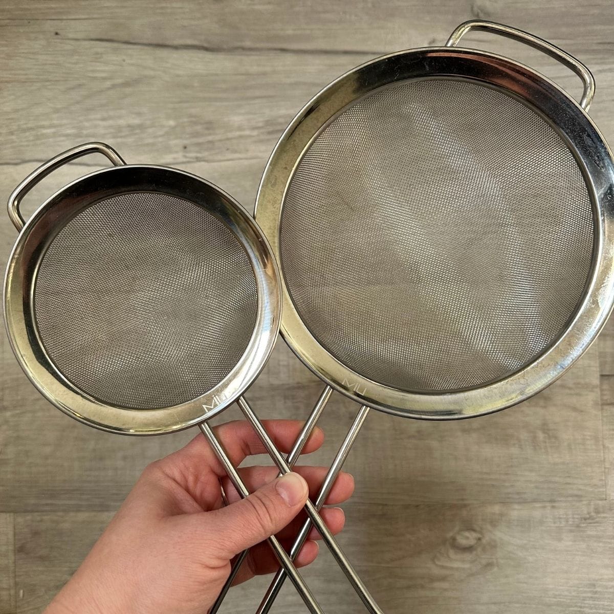 Two mesh sieves.